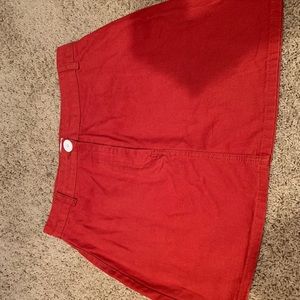 Orange denim mini skirt.